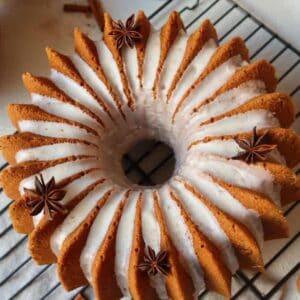 Gluten Free Orange Spiced Bundt Cake on a cooling rack.