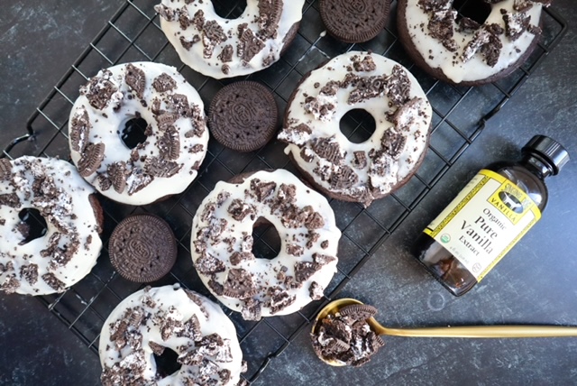 Gluten, egg, and dairy free Oreo donuts with a vanilla bottle
