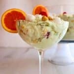 A martini glass of Pistachio Ambrosia Salad.