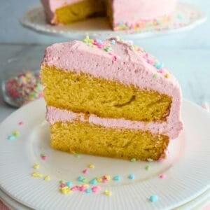 Vanilla bean cake slice in a white plate.