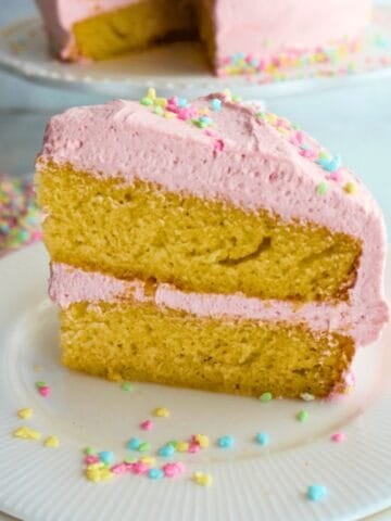 Vanilla bean cake slice in a white plate.