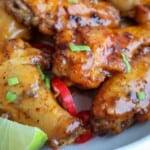 Chicken wings with sauce and lime