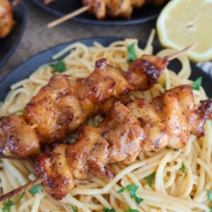 skewers with pasta and a lemon slice