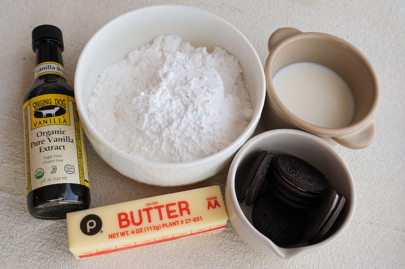 Butter, sugar, vanilla extract in a white background