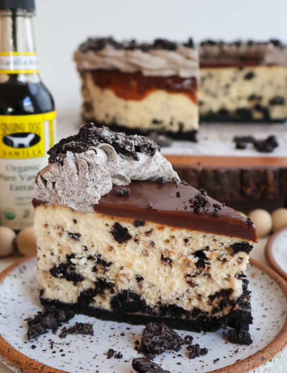 Oreo Cheesecake piece in a white/brown plate