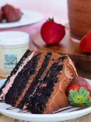 Slice of chocolate strawberry cake on plate.