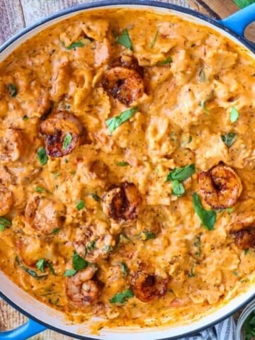 Overhead shot of shrimp pasta in skillet.