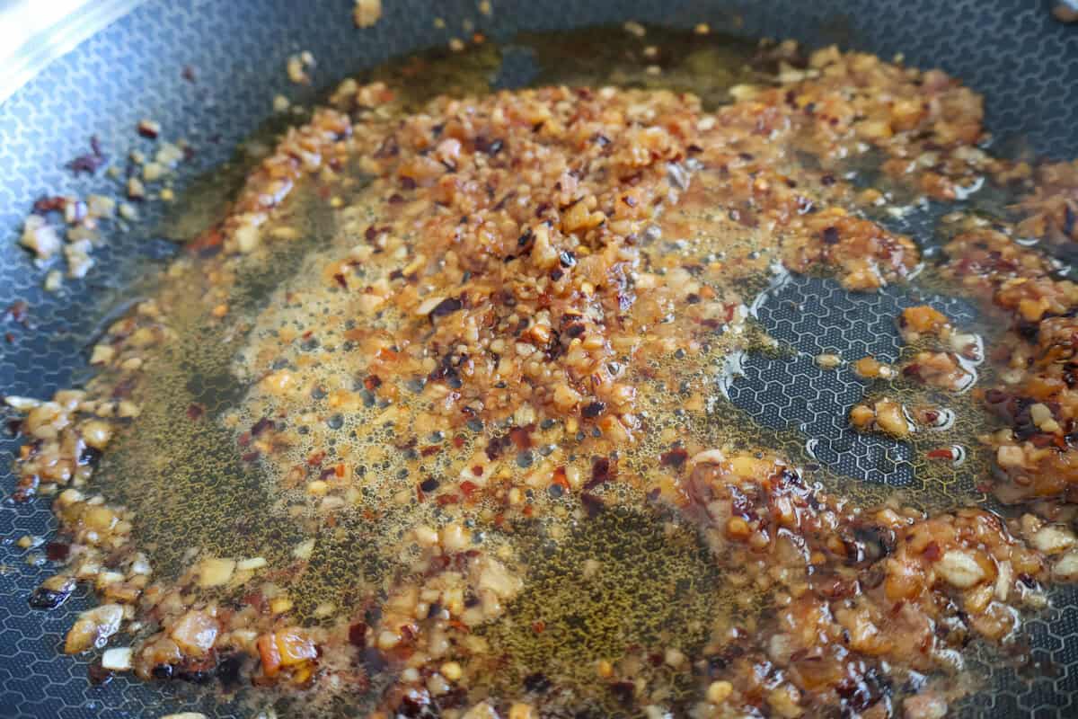 Skillet with butter and aromatics
