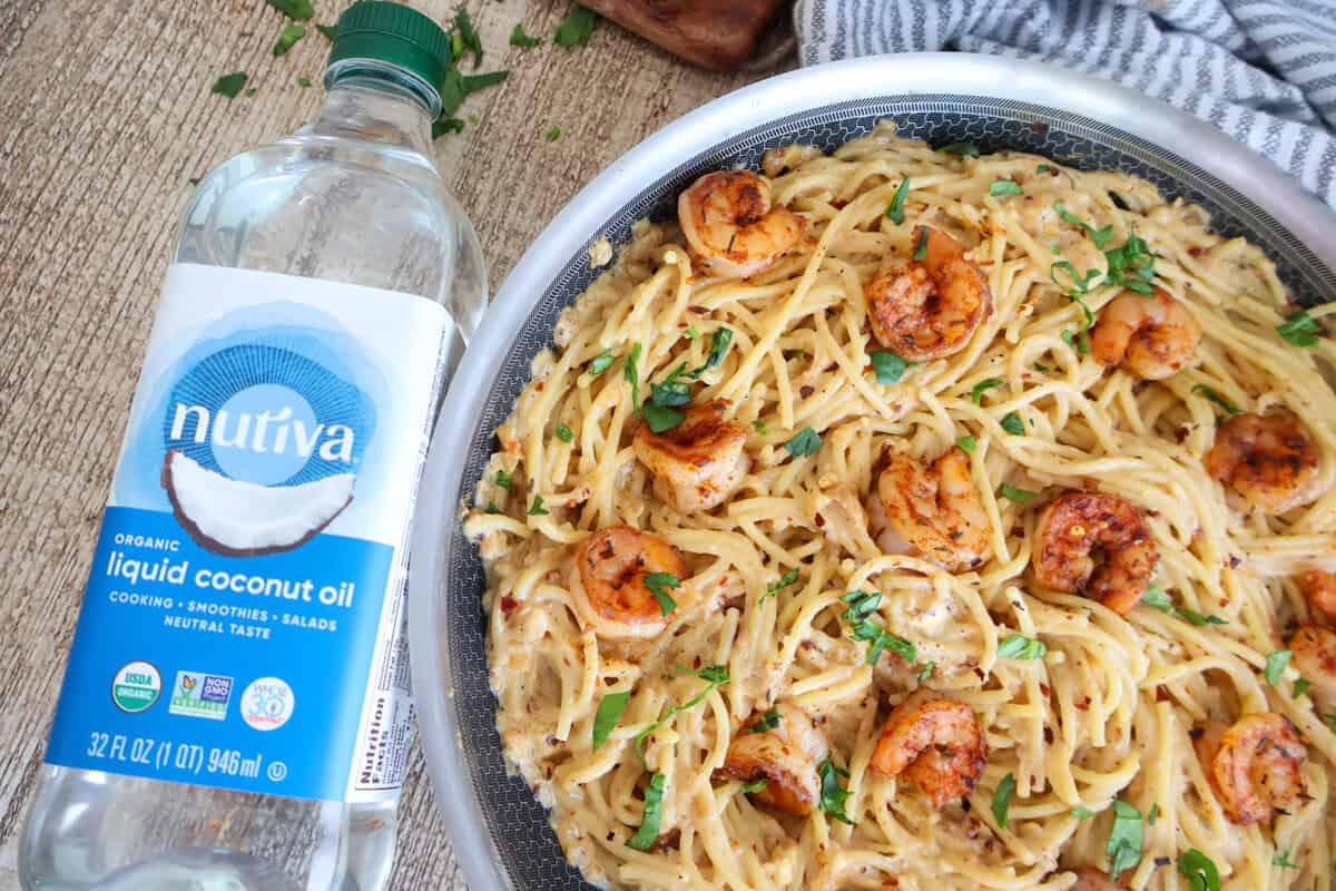 Skillet full of lemon garlic shrimp pasta.