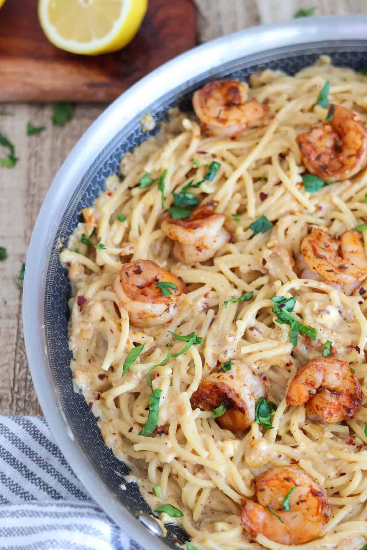Overhead shot of skillet with shrimp pasta