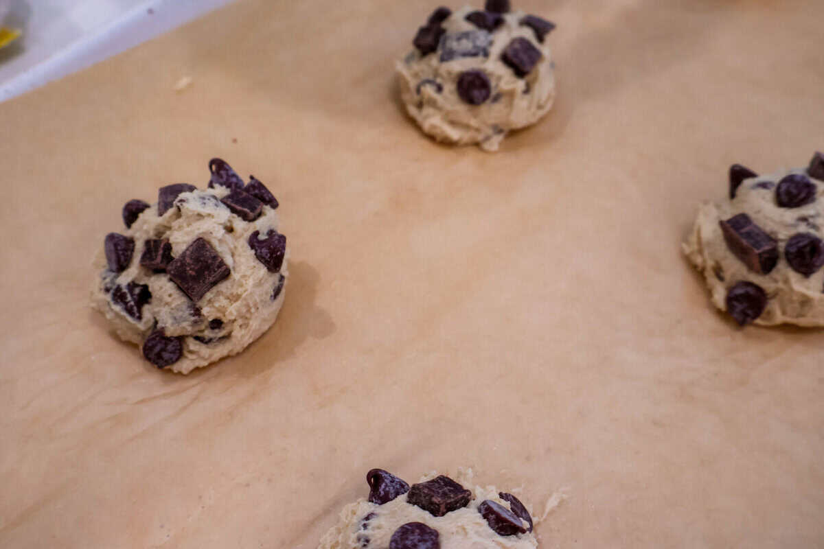 Chocolate chip cookie dough balls on baking sheet