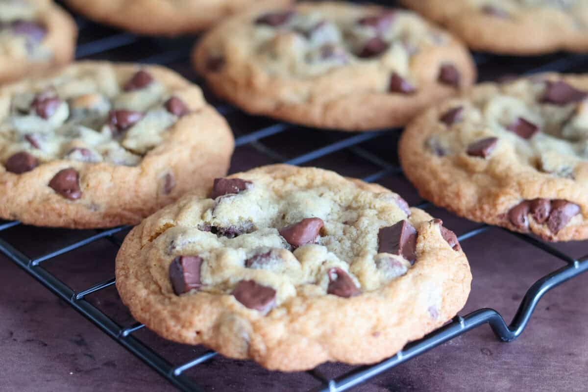 Chocolate chip cookies on wire cooling rack.