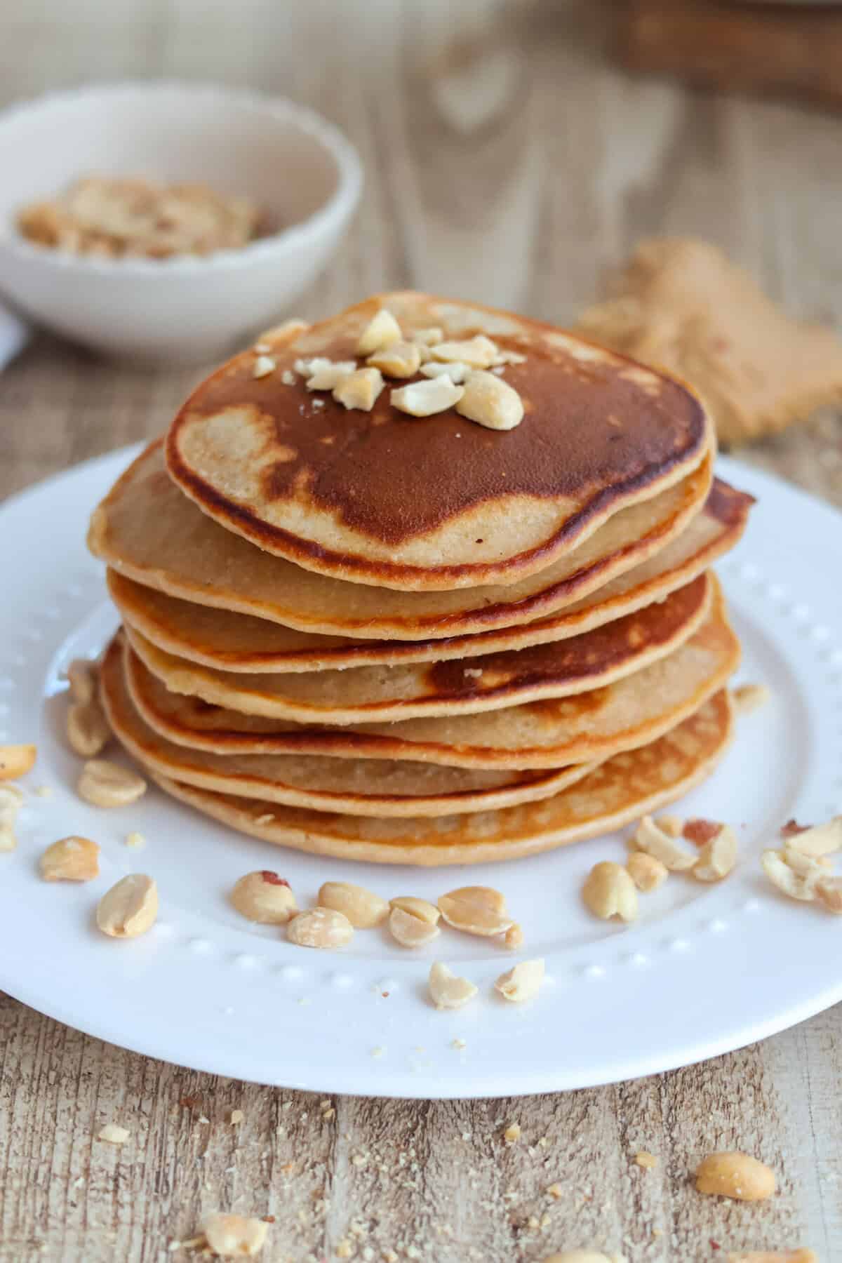Stack of peanut butter pancakes on plate. 