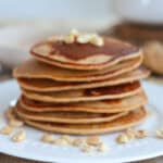 Stack of pancakes on a plate.