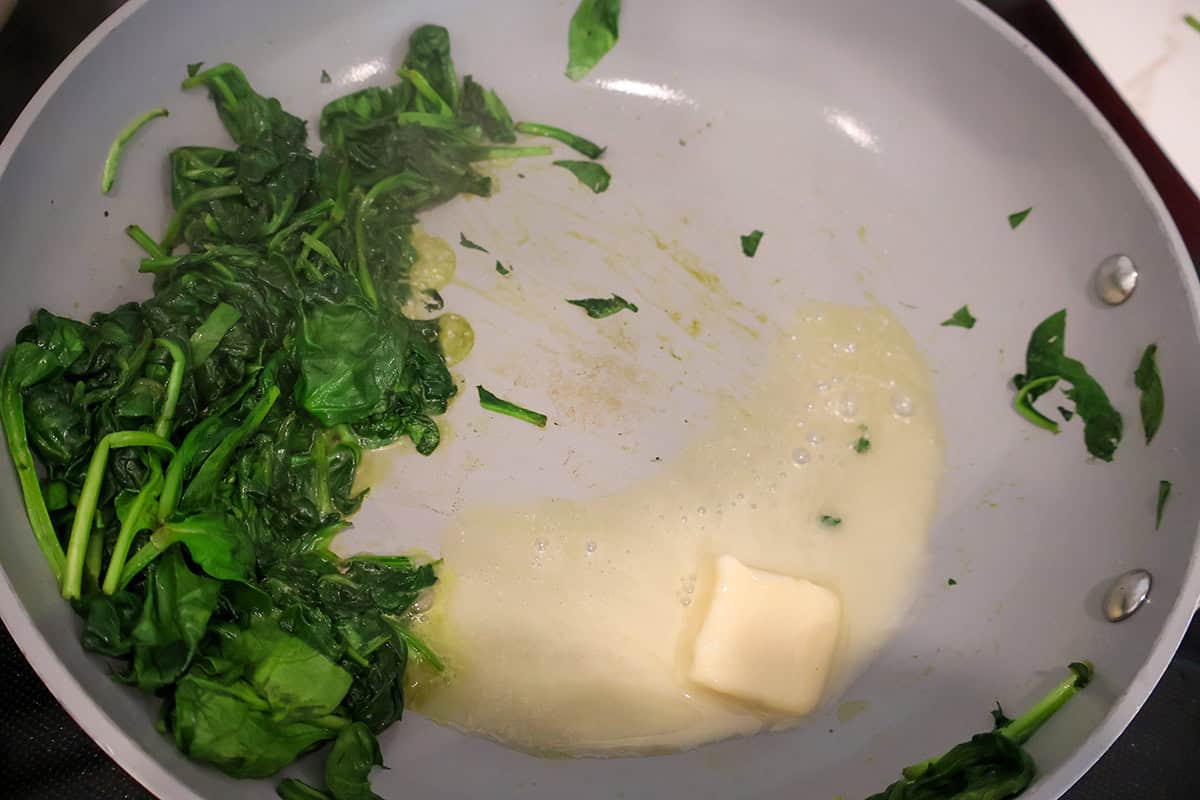 Saute pan with spinach and butter.