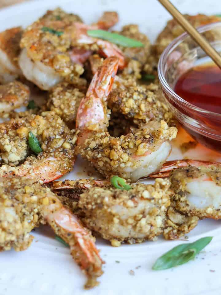 A plateful of hot honey shrimp with hot honey sauce.