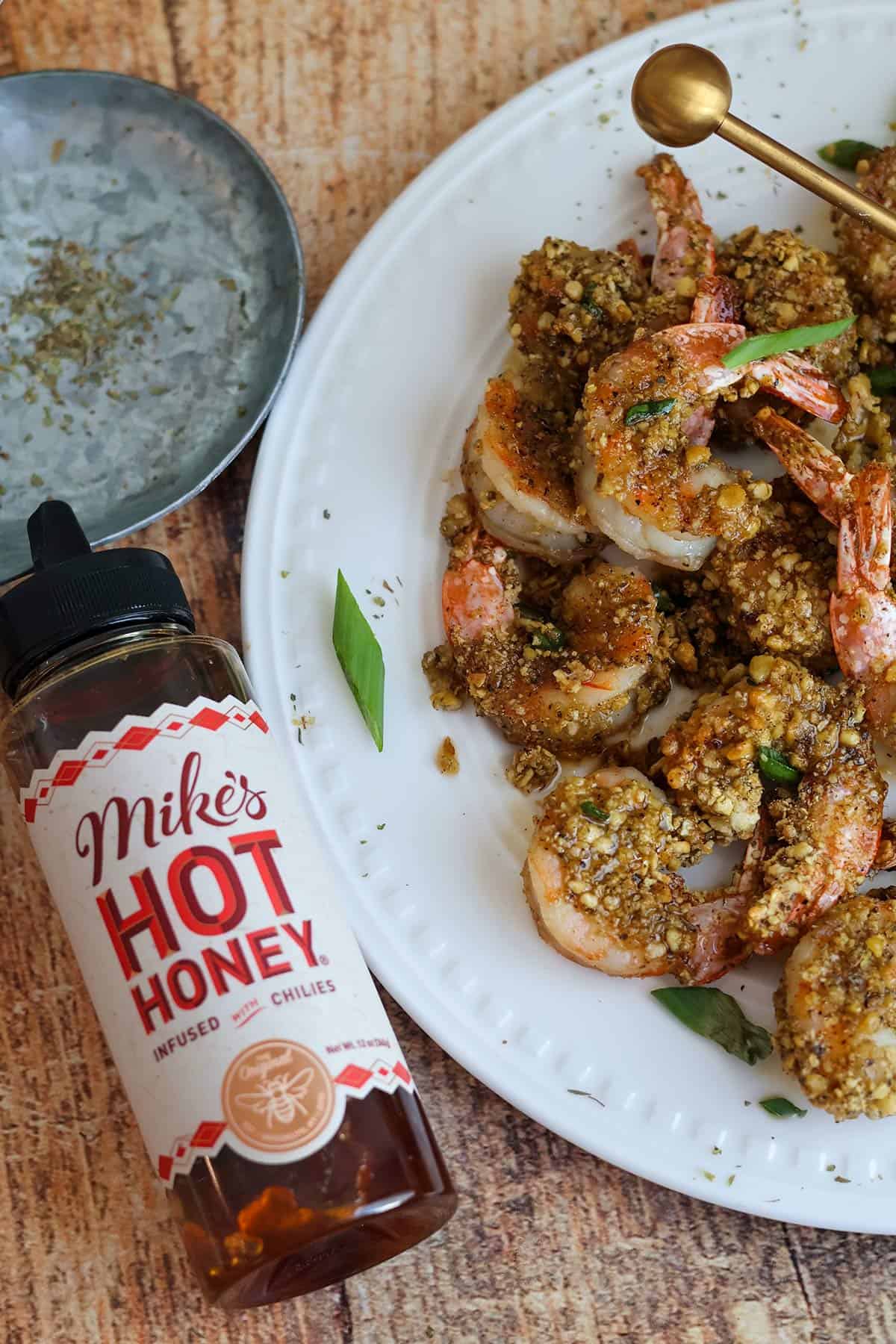 An overhead shot of a plateful of crispy breaded shrimp. 