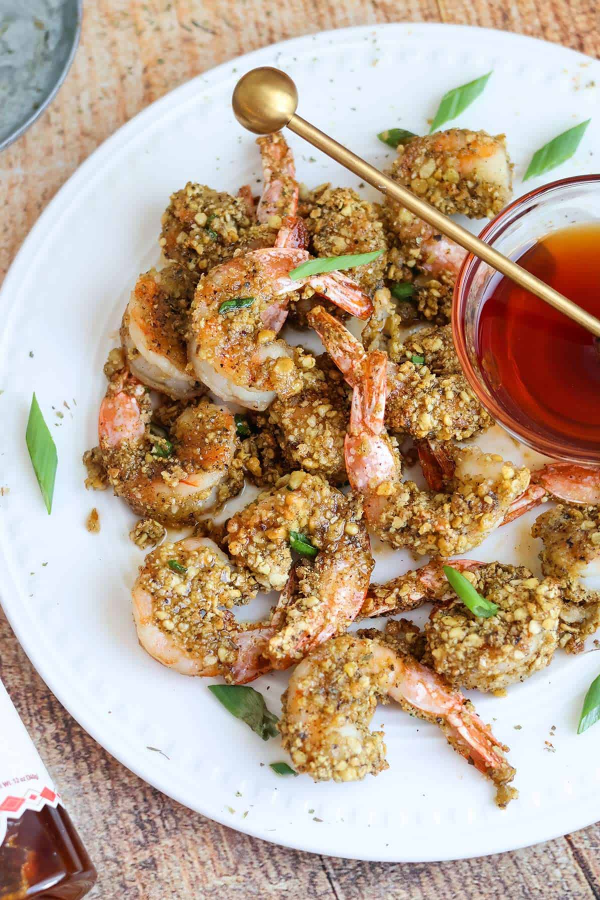 An overhead shot of hot honey shrimp on plate. 
