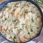 A skillet filled with creamy shrimp pasta.