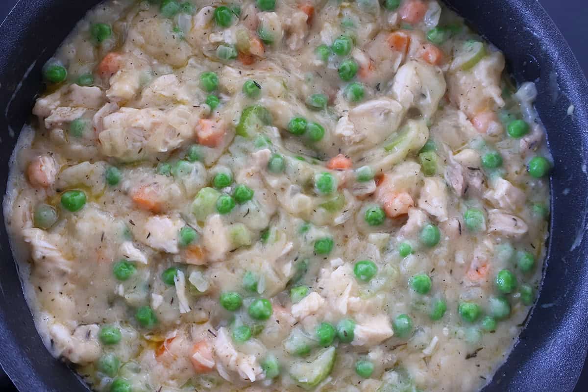 A skillet full of pot pie filling.