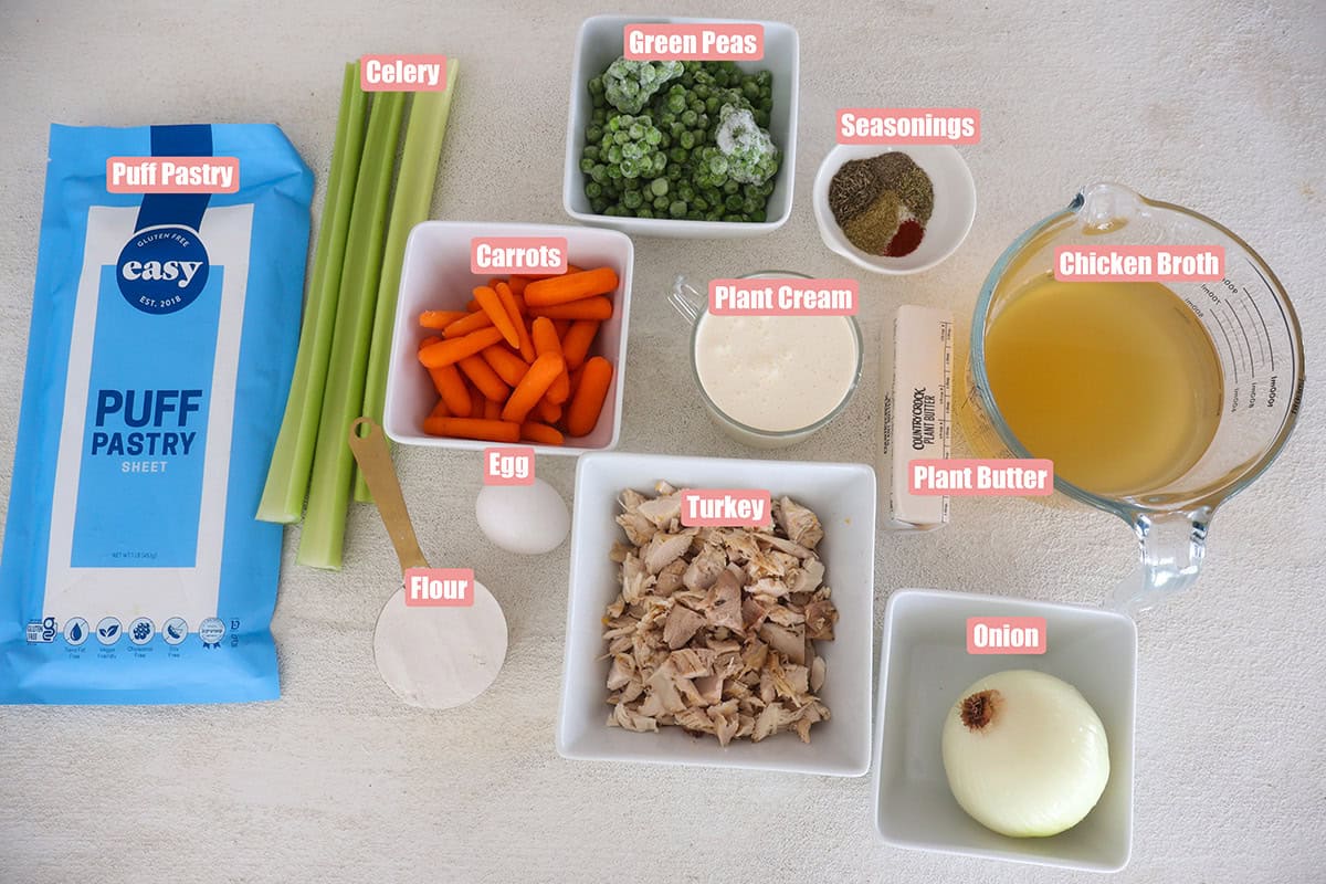 Individual pot pie ingredients in bowls.