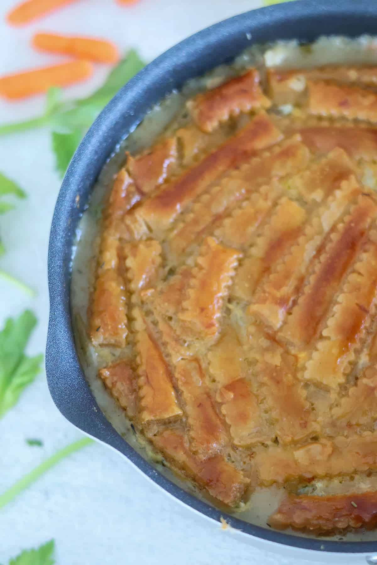 A skillet full of baked turkey pot pie.