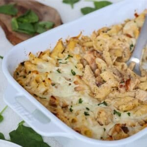 Chicken and Pasta Alfredo Bake in a white baking dish.