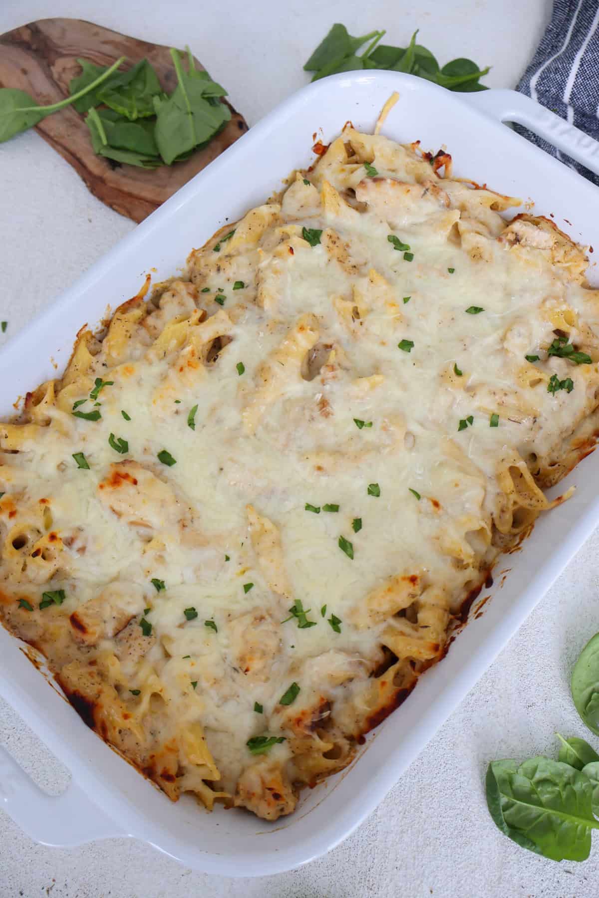 Chicken and Pasta Alfredo Bake inside a white casserole dish.