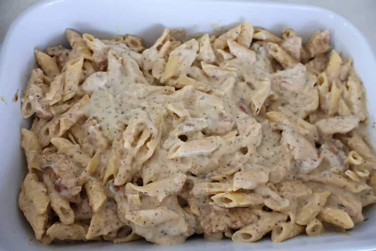 Chicken and Pasta Alfred in a white baking pan.