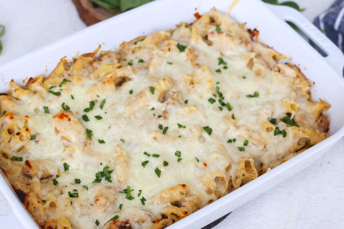 Chicken and Pasta Alfredo Bake in a white baking dish.