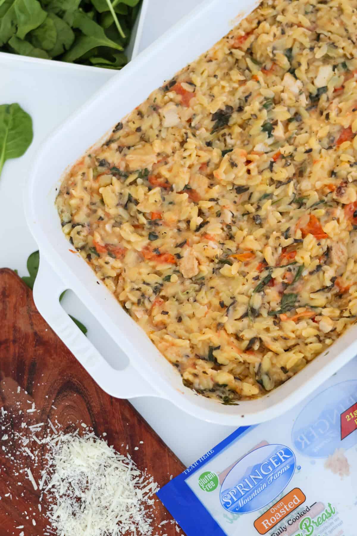 A baking pan of Spinach Artichoke Baked Orzo Pasta