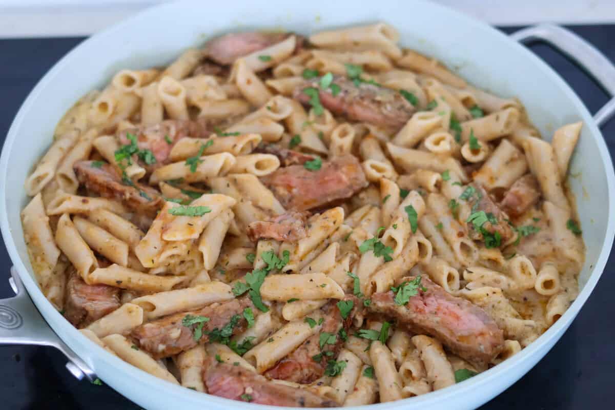 A finished pan of Creamy Garlic Steak Pasta.