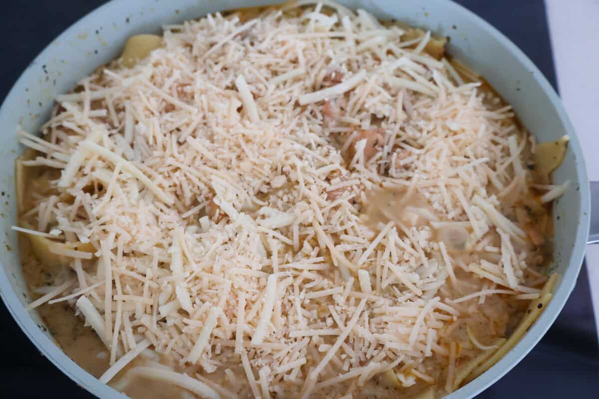 Gluten Free Chicken Alfredo in a pan covered in cheese.