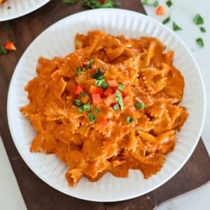 A white plate of Quick And Easy Chorizo Pasta.