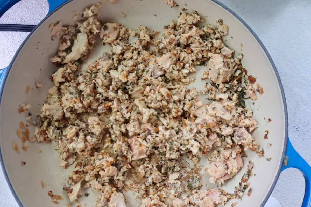 Canned salmon cooking in a pan.