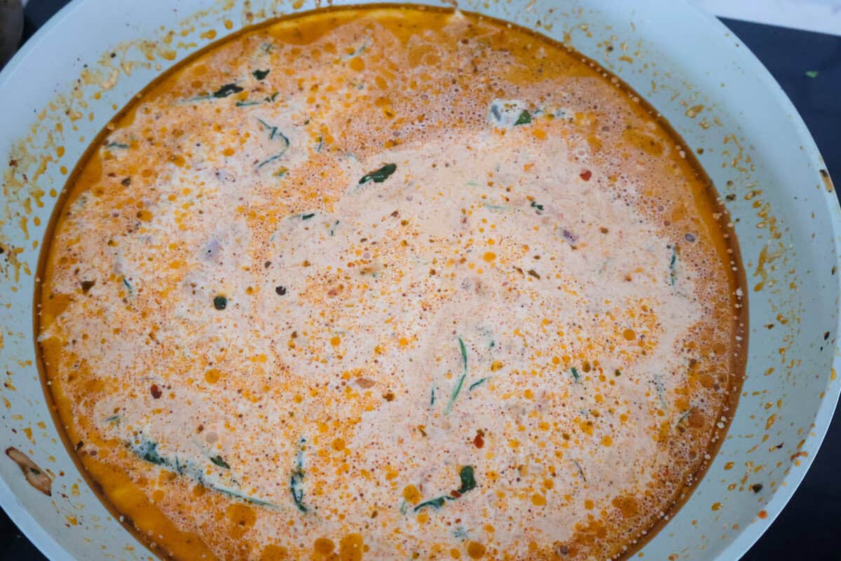 Pesto and Sun Dried Tomato sauce in a pan.