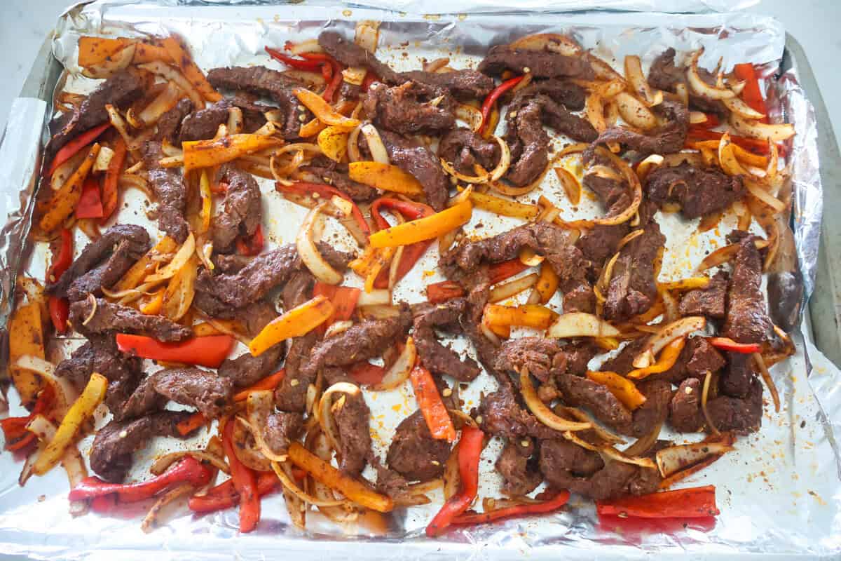 A sheet pan of cooked Steak Fajitas.