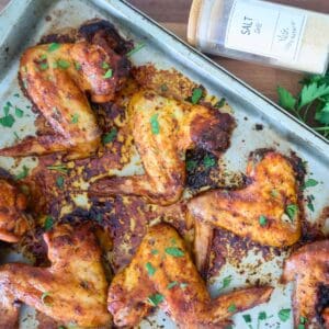 A sheet pan of oven baked whole chicken wings.