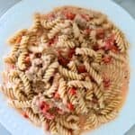 A plate of cream sausage pasta.