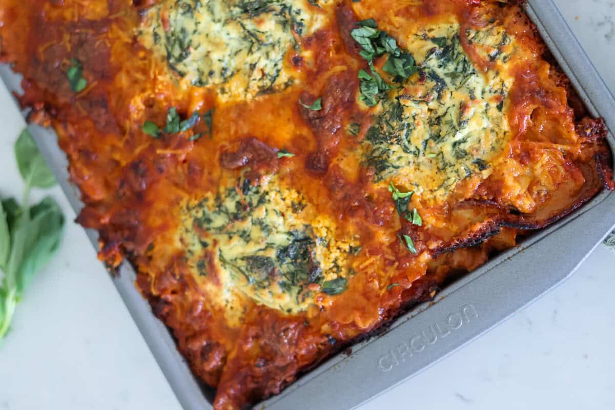 A close of of sheet pan lasagna fresh out of the oven.