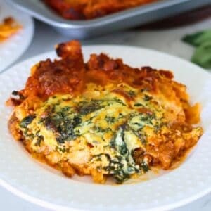 A white plate of Sheet Pan Lasagna.
