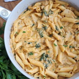Skillet full of creamy chicken pasta.