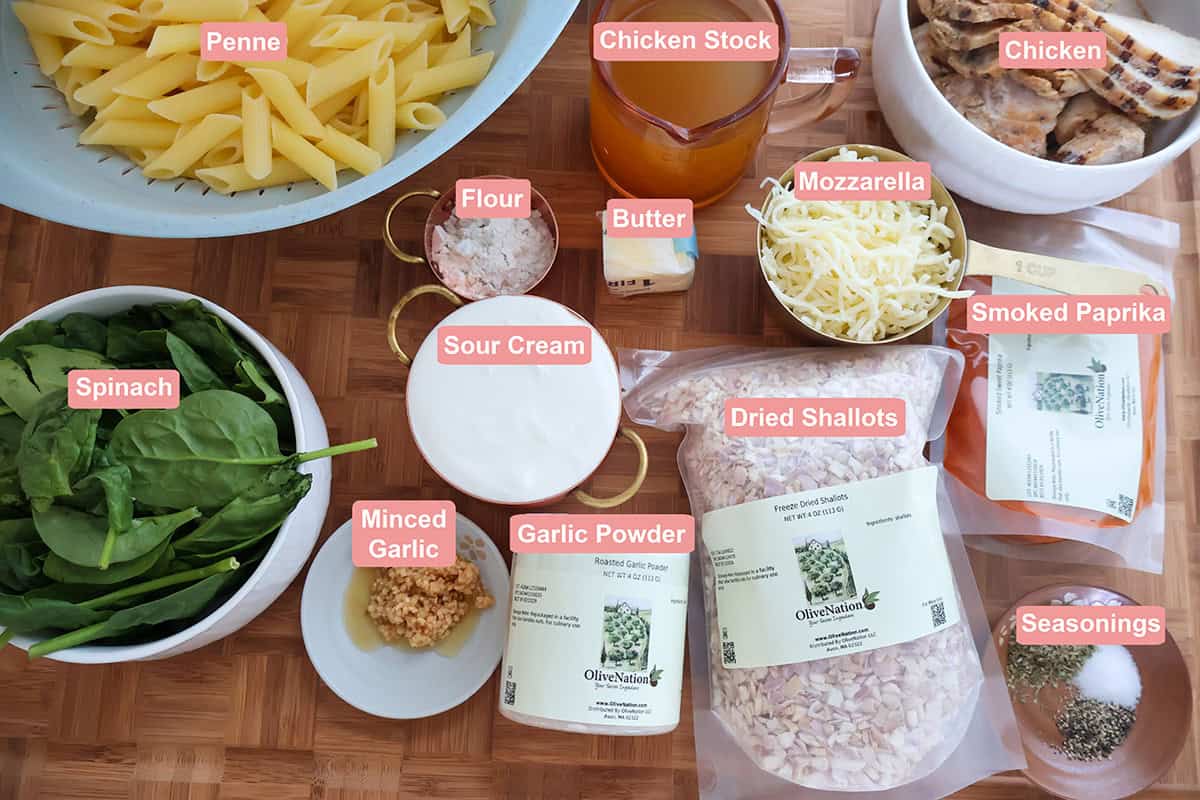 Individual sour cream pasta ingredients on a table.