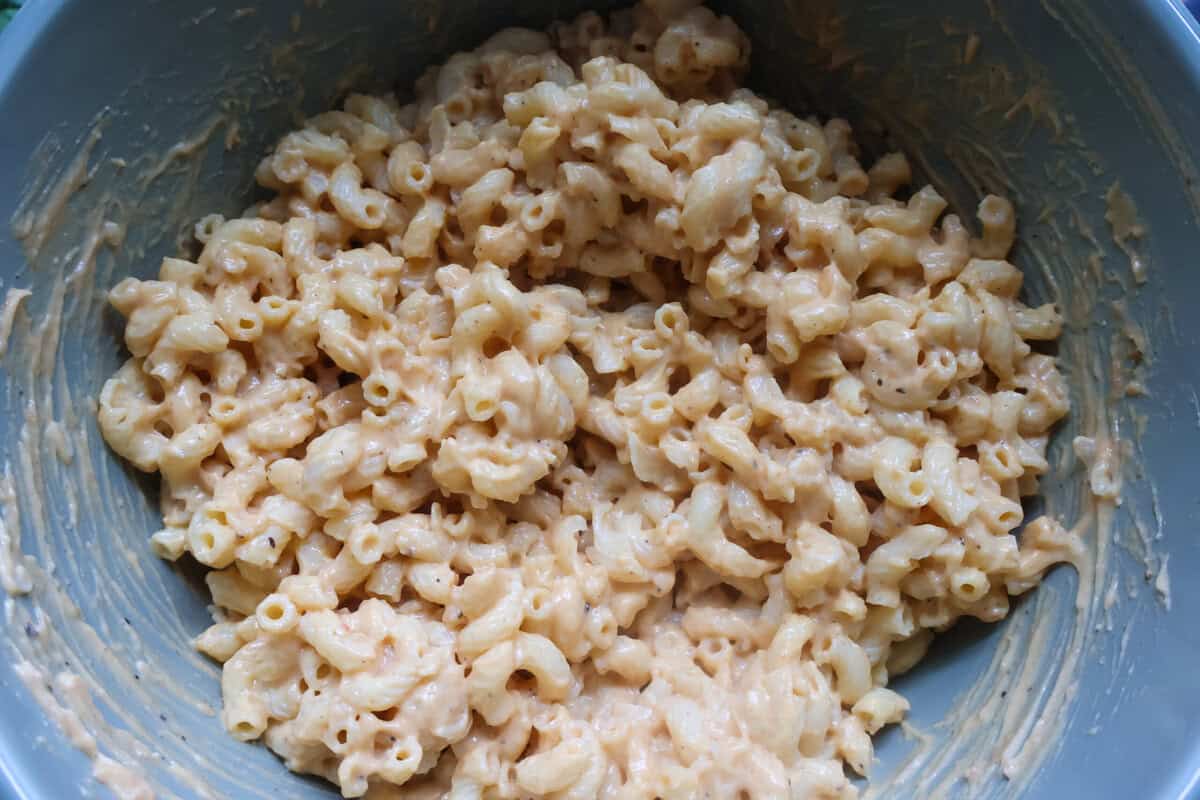 Mac and cheese in a mixing bowl.
