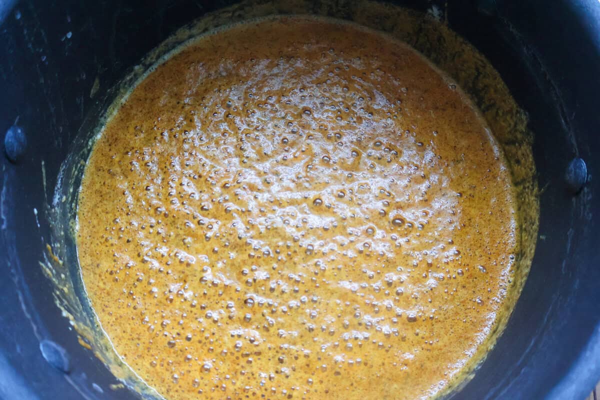 The base of a cheese cause in a black skillet.