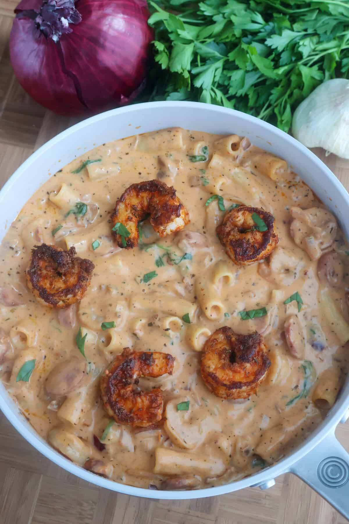 A skillet of New Orleans Marry Me Pasta with shrimp on top.