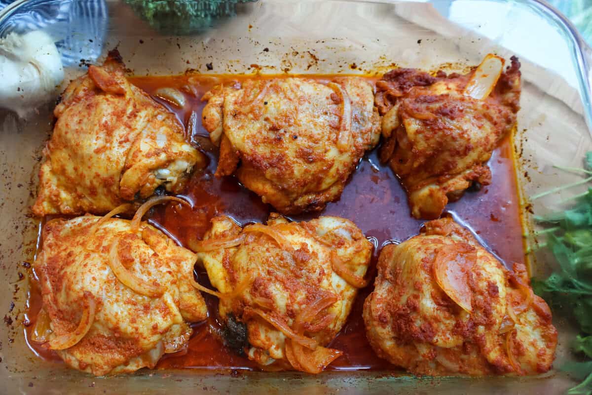 Baked chicken thighs fresh out of the oven before being glazed