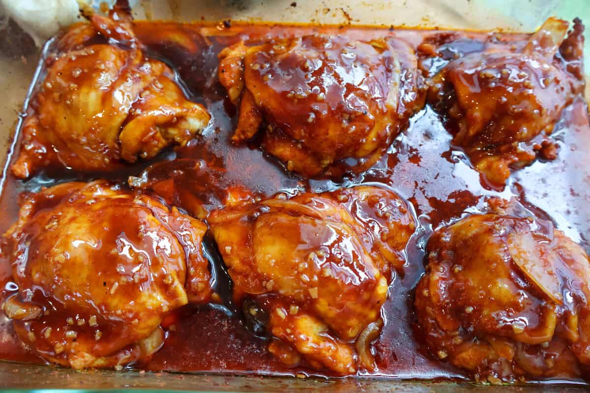 Baked BBQ chicken thighs brushed with sticky glaze and broiled to a caramelized finish