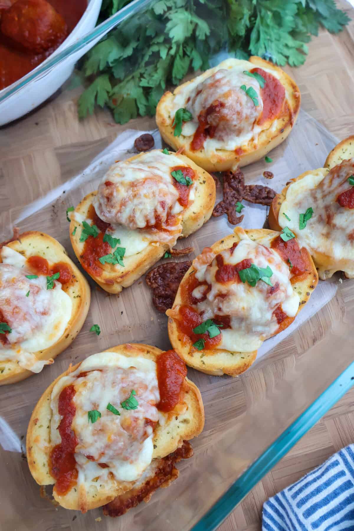 Baked Texas Toast Meatball Melts with melted, bubbly mozzarella cheese