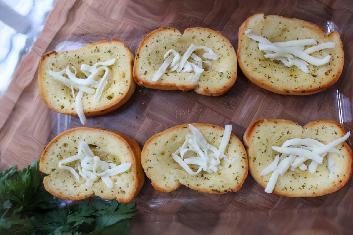 Mozzarella cheese and a meatball nestled into the well of toasted Texas Toast